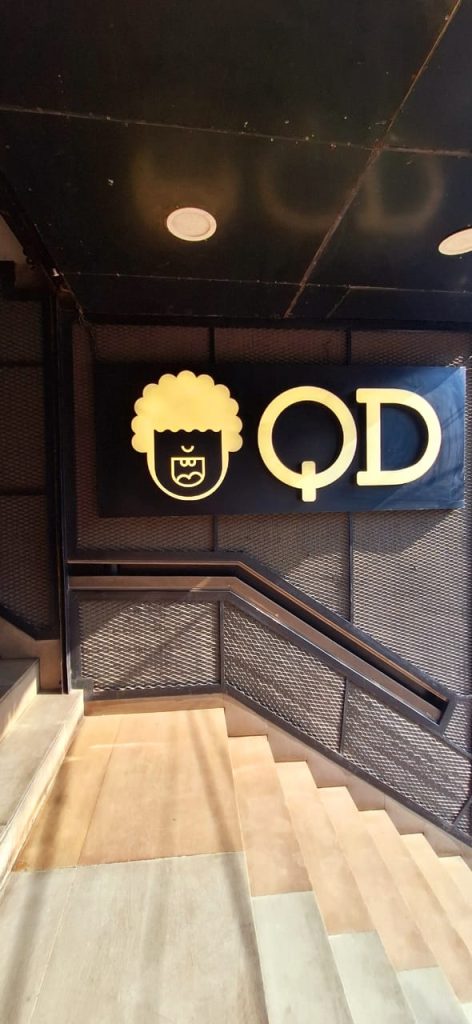 sign board of QD's restaurant wall